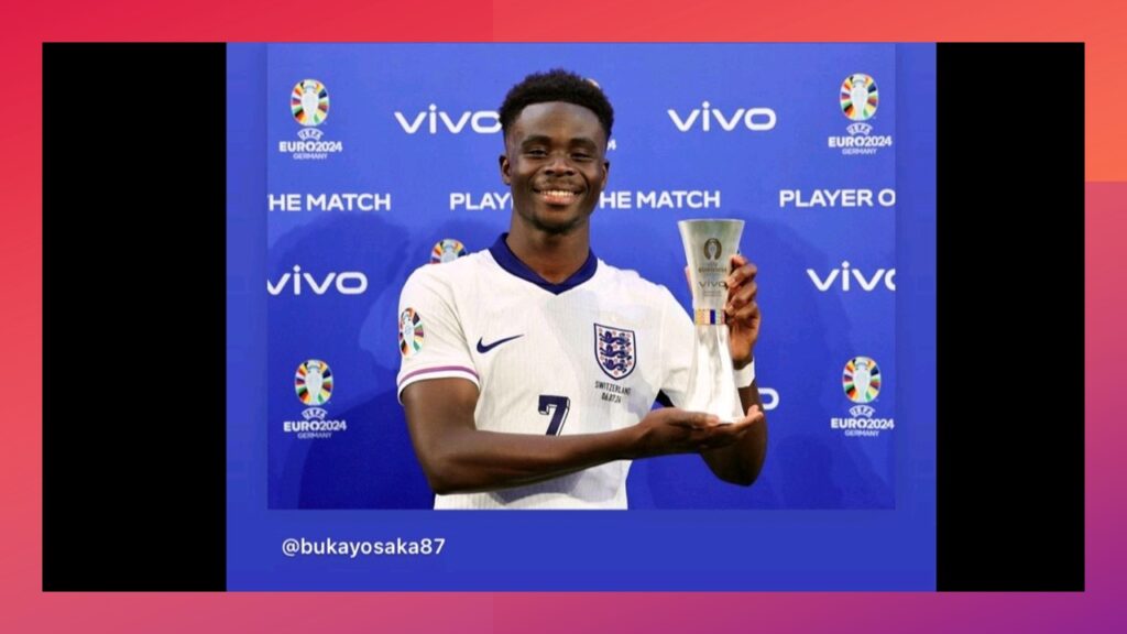 Saka holding player of the macth trophy in his England top with a beaming smile- posted on his X Account